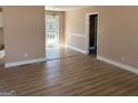 Bright living room with hardwood floors and access to the backyard at 285 Queen Helen Ln, Jonesboro, GA 30236