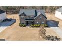 Two-story house, landscaped yard, and driveway at 160 Traditions Ln, Hampton, GA 30228