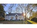 Beautiful craftsman home with a tree-lined street at 213 W Hightower Trl, Social Circle, GA 30025