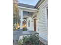 Inviting front porch with detailed woodwork and lighting at 213 W Hightower Trl, Social Circle, GA 30025