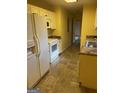 Bright kitchen with white cabinets and linoleum flooring at 1276 Turner Church Rd, Mcdonough, GA 30252