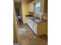 Kitchen with white cabinets and tile floor at 1276 Turner Church Rd, Mcdonough, GA 30252