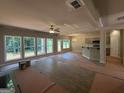 Spacious living room with large windows offering natural light, neutral paint colors and an open layout at 142 Asa Moseley Rd, Mcdonough, GA 30252