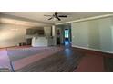 Open living area with new flooring, flowing into the kitchen, perfect for entertaining and everyday living at 142 Asa Moseley Rd, Mcdonough, GA 30252