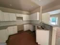 Modern kitchen with white cabinets, granite countertops, and stainless steel sink at 150 Asa Moseley Rd, Mcdonough, GA 30252