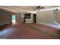 Bright open-concept living space with wood floors and an adjacent modern kitchen at 150 Asa Moseley Rd, Mcdonough, GA 30252