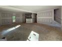 Spacious living area showcasing an open floor plan with easy access to the kitchen and outdoor spaces at 150 Asa Moseley Rd, Mcdonough, GA 30252