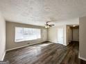 Spacious living area with hardwood floors and lots of natural light at 3006 Remington St, East Point, GA 30344