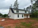 Newly built home showing its exterior features, including a side-entry garage and dark roof at 136 Asa Moseley Rd, Mcdonough, GA 30252
