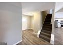 Front entry with stairs leading upstairs and view into the kitchen at 270 Marriott Dr, South Fulton, GA 30349