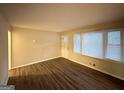 Spacious living room with hardwood floors and large windows at 211 Hemphill School Rd, Atlanta, GA 30331