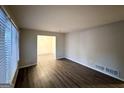 Bright and airy living room with hardwood floors and access to the dining area at 211 Hemphill School Rd, Atlanta, GA 30331
