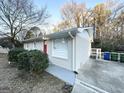 Side view of the house, showcasing additional parking and landscaping at 3961 Cornell Sw Blvd, Atlanta, GA 30331