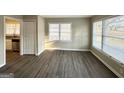 Bright living room with hardwood floors and large windows at 1991 Marvin Sw Ln, Atlanta, GA 30311