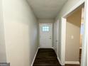 Bright entryway with dark laminate flooring and interior door at 2048 Glendale Dr, Decatur, GA 30032