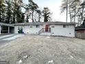 Brick Ranch home with a red front door and lush lawn at 2048 Glendale Dr, Decatur, GA 30032