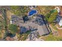 Aerial view of a home showcasing a private swimming pool and mature landscaping at 505 River Valley Rd, Sandy Springs, GA 30328