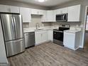 Modern kitchen featuring stainless steel appliances and quartz countertops at 471 Glen Terrace Rd, Auburn, GA 30011