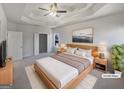 Spacious main bedroom features a tray ceiling, soft lighting, and ample space to relax at 3905 Colonial Sw Trl, Lilburn, GA 30047