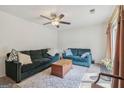 Spacious living room featuring plush sofas, a patterned rug, and ample natural light at 1144 Kipling Se St, Atlanta, GA 30315