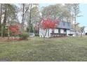 House with red foliage and a shed in the backyard at 1102 Hip Pocket Rd, Peachtree City, GA 30269