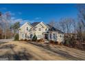 Two-story house with stucco siding, landscaping, and a large yard at 45 Kinloch Ct, Covington, GA 30014