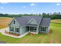 Desirable single-Gathering home with green siding, black shutters, and lush green lawn at 123 Oak Road, Locust Grove, GA 30248