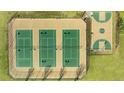Aerial view of three tennis courts and a half-court basketball court at 13232 Tolstoy Drive, Covington, GA 30014