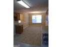 Bright dining area with wood cabinets and flooring at 3590 Stephens Creek Pl, Loganville, GA 30052