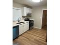 Functional kitchen boasts stainless steel appliances, white cabinets, and modern countertops at 752 Jefferson Sw Ave, Atlanta, GA 30315