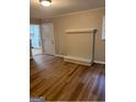 Cozy living room featuring hardwood floors, a decorative fireplace, and neutral paint at 752 Jefferson Sw Ave, Atlanta, GA 30315