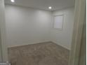 Well-lit bedroom featuring neutral walls and carpet at 553 Highway 279, Fayetteville, GA 30214
