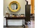 Bright entryway with a large gold mirror and console table at 144 Cottsford Sw Dr # 22, South Fulton, GA 30331