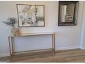 Close up of table decor in foyer with framed art and mirror at 376 Collier Mills Road, Lawrenceville, GA 30045