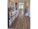 Inviting foyer with wood floors, decor table, and stylish staircase at 376 Collier Mills Road, Lawrenceville, GA 30045