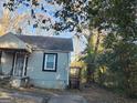 Charming single-story home featuring classic windows and a compact deck in the backyard at 4692 College St, Forest Park, GA 30297