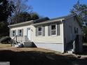 House exterior showcasing a light beige color and landscaping at 139 Cecelia Cir, Jonesboro, GA 30236
