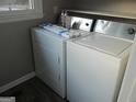 Neat laundry room with white washer and dryer units, maximizing space and efficiency at 139 Cecelia Cir, Jonesboro, GA 30236