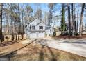 Two-story house with a three-car garage and a long driveway at 118 Michael Ct, Dallas, GA 30157