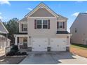 Charming two-story home with a two-car garage, neutral siding, and landscaped yard at 151 Brasch Park Dr, Grantville, GA 30220