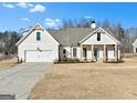 Charming house featuring a front porch and landscaped yard at 43 Harmony Woods Dr, Dallas, GA 30157