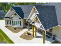 Inviting covered porch with wooden columns and a stone walkway at 1291 Pleasant Grove Church Rd, Villa Rica, GA 30180