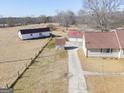 Aerial view of property showing house and outbuildings at 444 Agape Rd, Carrollton, GA 30116