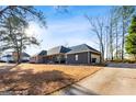 Ranch style home with attached garage and driveway at 7943 Lake Ridge Dr, Jonesboro, GA 30236