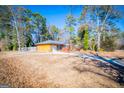 Brick ranch house with attached garage and driveway at 653 Temple St, Lithia Springs, GA 30122
