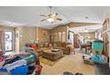 Spacious living room with a view of the kitchen and dining areas at 5899 Meadow Ln, Rex, GA 30273