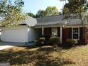 Brick front house with a two-car garage and spacious yard at 2470 Hillvale Cir, Lithonia, GA 30058