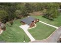 Expansive aerial view of the property highlighting its large lot, lush landscaping, and serene setting at 253 Edenwylde Ct, Hampton, GA 30228