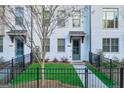 Townhome exterior with a green door and small landscaped front yard at 2893 Elmwood Se Dr, Smyrna, GA 30080