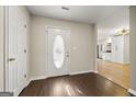 Bright entryway with new flooring and a view into the kitchen at 10 Oxford Pl, Sharpsburg, GA 30277